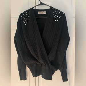 Elegant wrap sweater. Wide ribbed front with pearl detail. Size M.